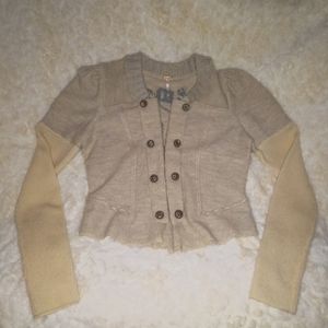 A beautiful military'ish wool Oatmeal sweater w grand detail stitching on back..
